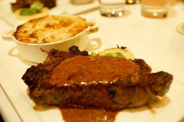 Yachtsman Steakhouse Full Review new york strip steak and potatoes gratin