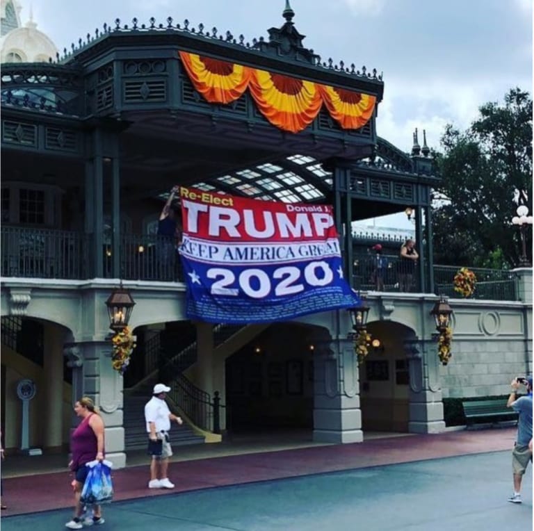 Guests Hangs Donald Trump 2020 Banner on Main Street in Disney's Magic