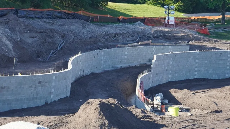 TRON Roller Coaster Construction Update March 2019 close up of double berm wall for railroad