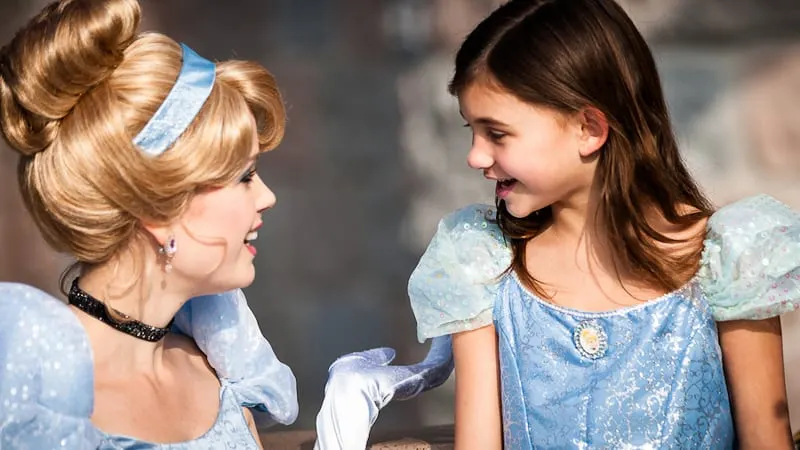 Cinderella's Royal Table Signature Celebration Package Cinderella with a little girl