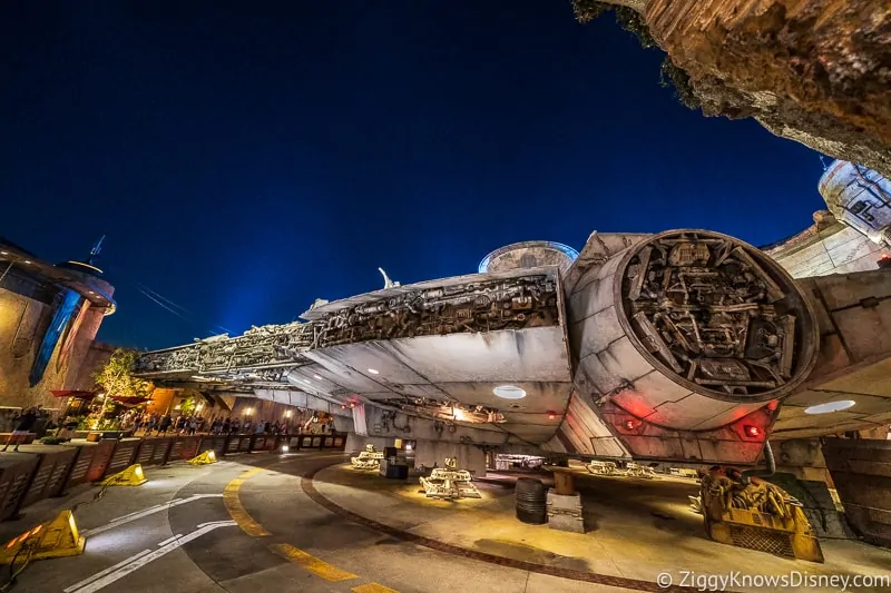 in queue outside the Millennium Falcon at night