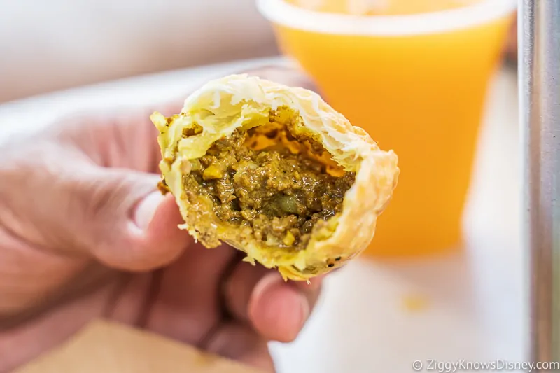 Nigerian Meat Pie inside Refreshment Outpost 2019 Epcot Food and Wine Festival