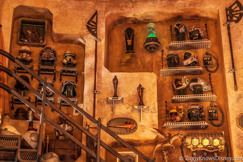 Wall of helmets in Dok Ondar's Den of Antiquities Galaxy's Edge