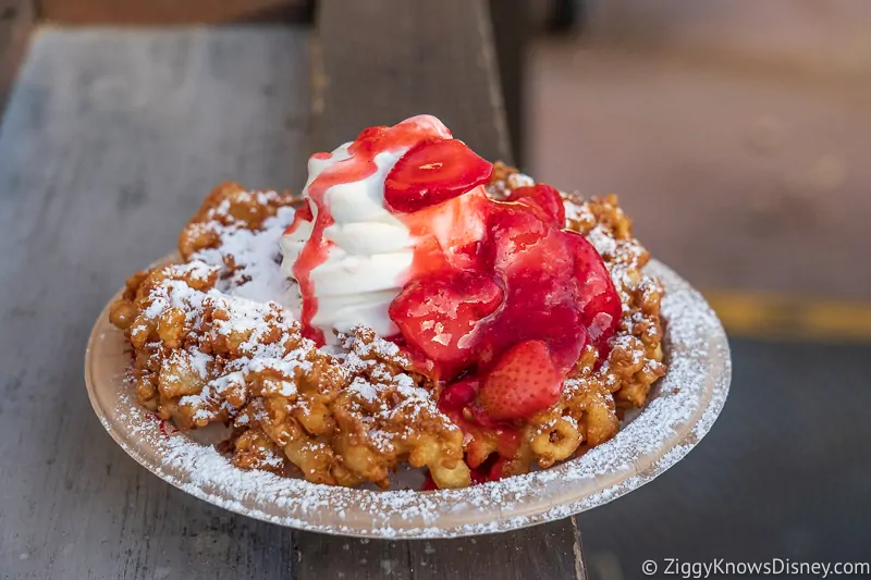 funnel cake with ice cream and strawberries Epic Eats Best Snacks at Hollywood Studios