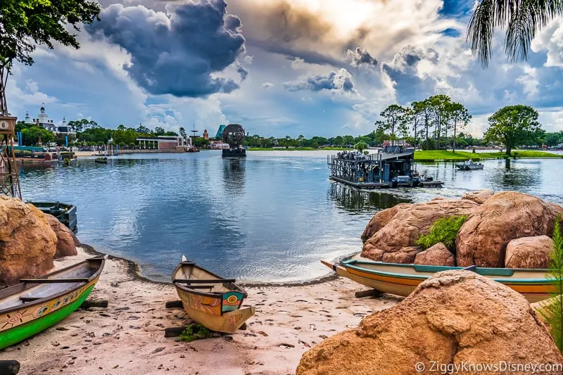 View of World Showcase Lagoon EPCOT with canoe on the beach