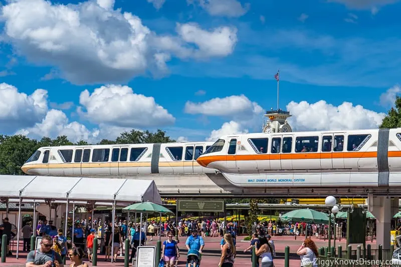 two monorails passing each other at Magic Kingdom entrance