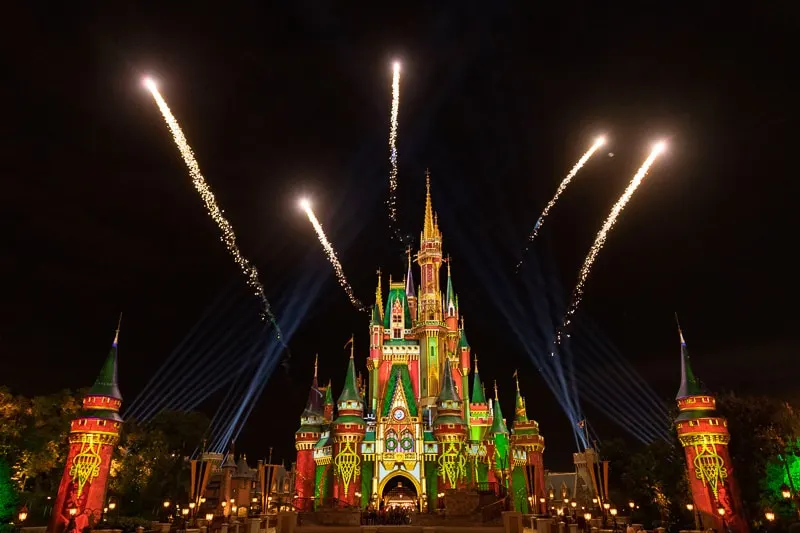 fireworks during Magic Kingdom holiday projection show