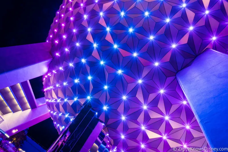 Spaceship Earth lit up at night in EPCOT