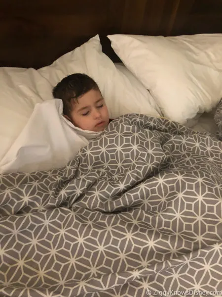 toddler sleeping in bed at Disney World