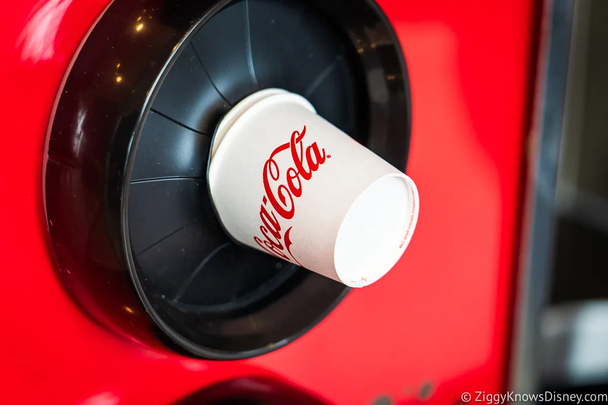 Cups next to soda machine