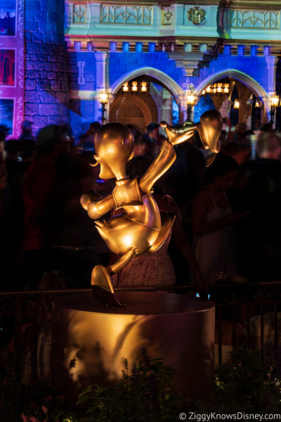 Donald Duck 50th Golden Statue at night Magic Kingdom
