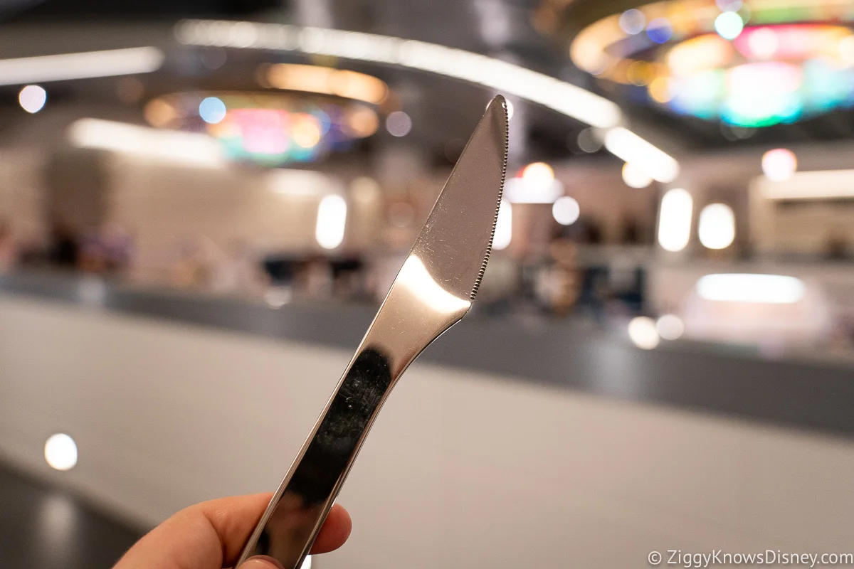 Holding knife in hand Crown of Corellia Dining Room