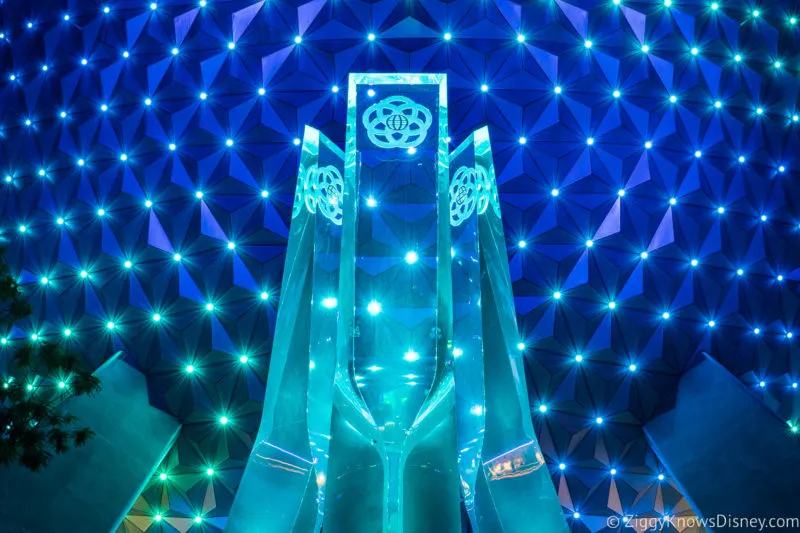 Fountain at EPCOT entrance in front of Spaceship Earth at night