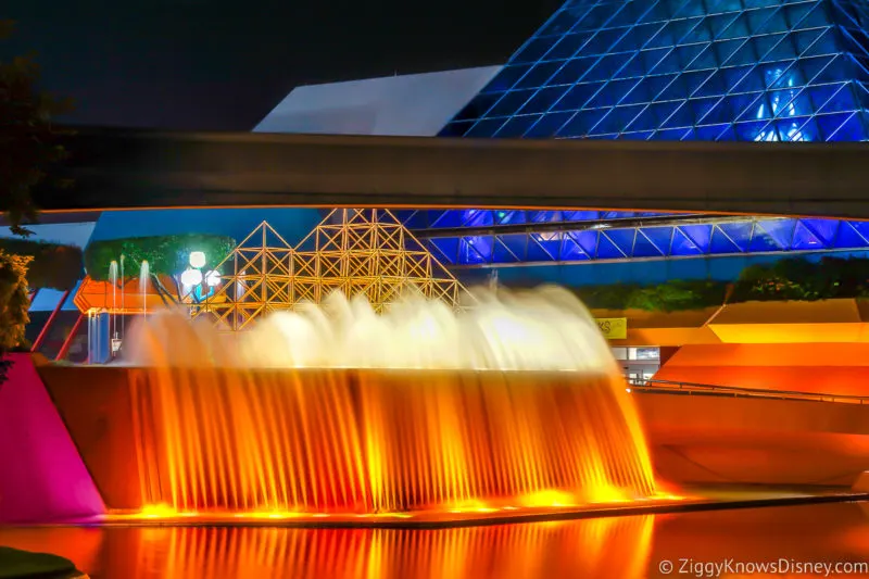 Imagination Pavilion fountain lit at night in EPCOT