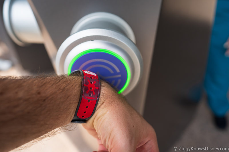 tapping in MagicBand to tap point at park entrance