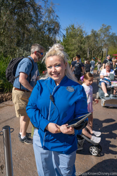 Disney World cast member helping guests