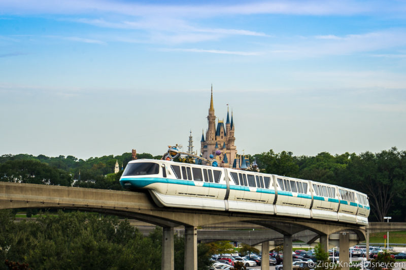 monorail passing by Cinderella Castle Magic Kingdom in background