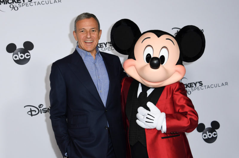 Bob Iger laughing with Mickey Mouse