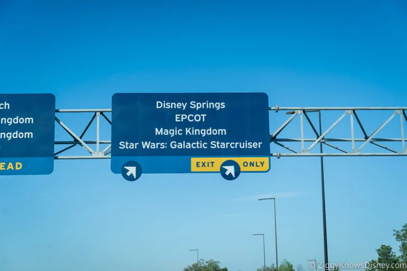 signs for theme parks on the highway at Disney World