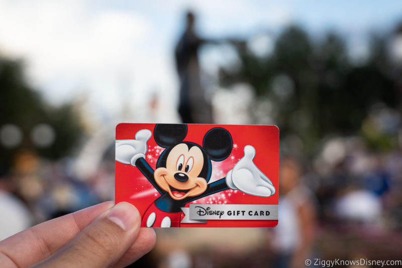 holding Disney Gift Card in Magic Kingdom