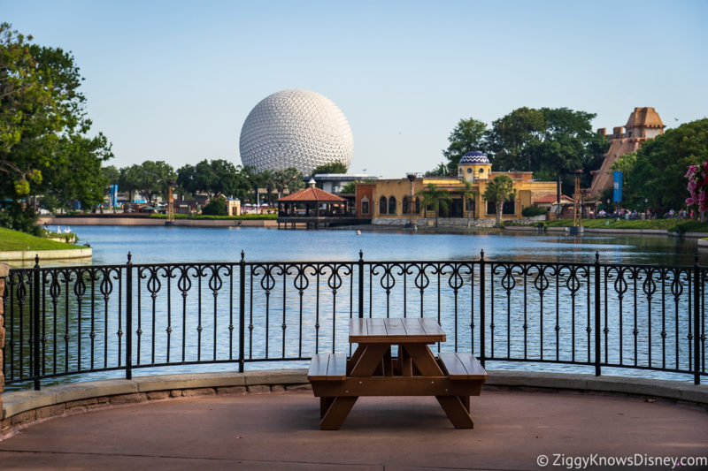 Spaceship Earth in the distance and picnic bench EPCOT countries World Showcase