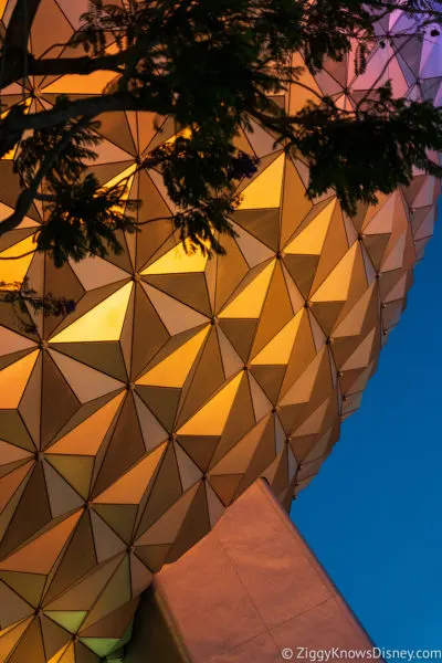 Spaceship Earth glowing colorful at night in EPCOT