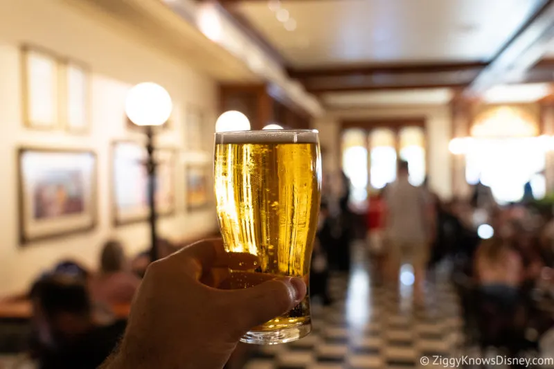 holding up a glass of beer Tony's Town Square Restaurant Magic Kingdom