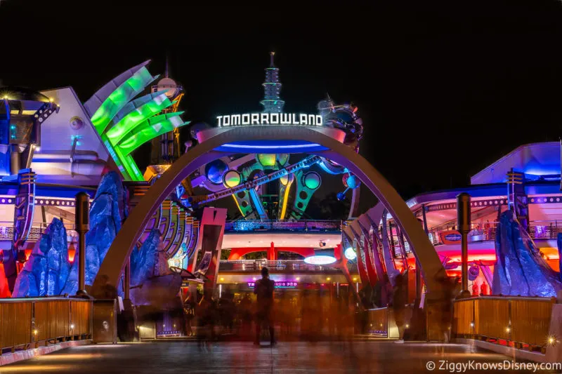 Tomorrowland sign with lights at night Magic Kingdom