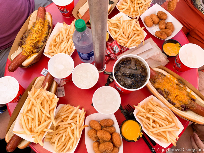 massive table of food at Casey's Corner with hot dogs and french fries