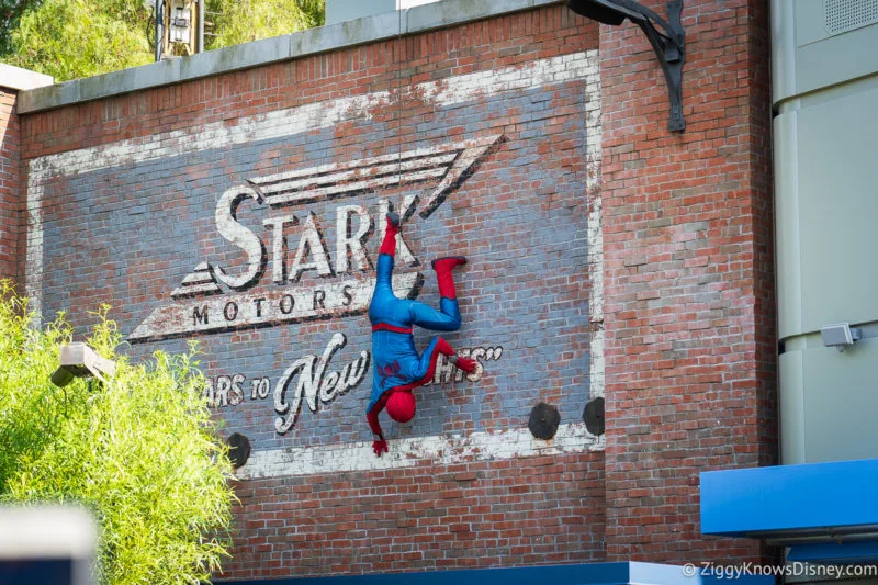 Spider-Man crawling on a wall in Avengers Campus