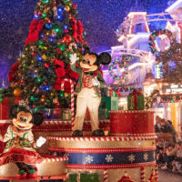 Mickey and Minnie in Christmas parade during Mickey's Very Merry Christmas Party returns