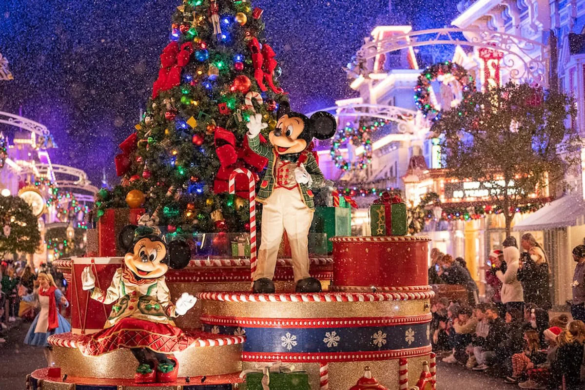 Mickey and Minnie in Christmas parade during Mickey's Very Merry Christmas Party returns
