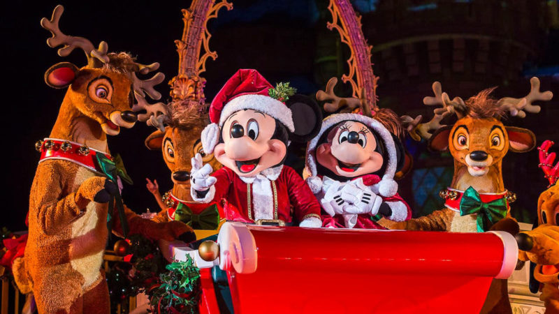 Mickey and Minnie Mouse in the Parade at night during Mickey's Very Merry Christmas Party Magic Kingdom