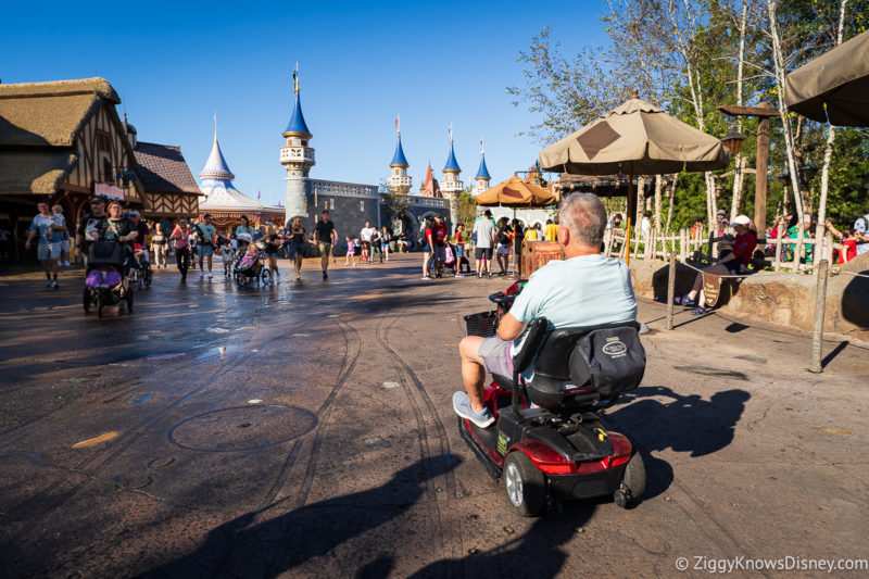 guest riding ECV scooter at Magic Kingdom Fantasyland