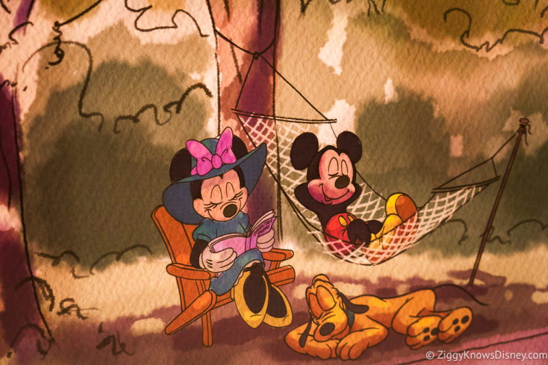 Mickey Mouse and Minnie Mouse painting sitting under a tree hammock
