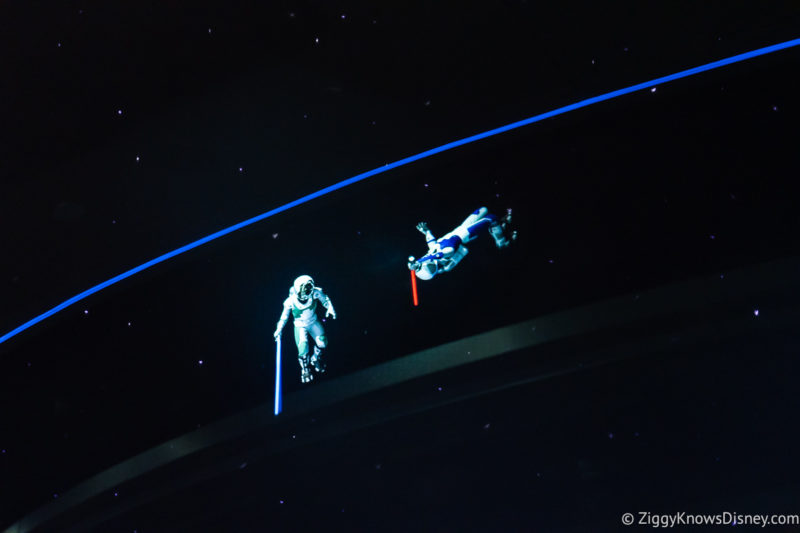 two astronauts fighting with lightsabers in space at Space 220 restaurant