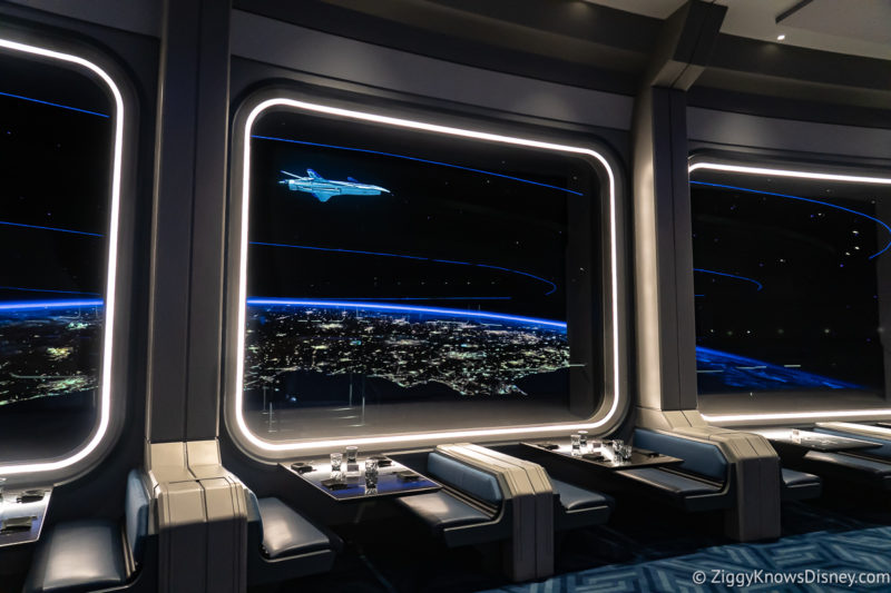 looking out the Space 220 windows at a spaceship in the dining room near tables