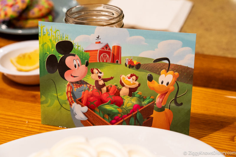 postcard with Mickey Pluto Chip & Dale eating fruit and veggies at Garden Grill EPCOT