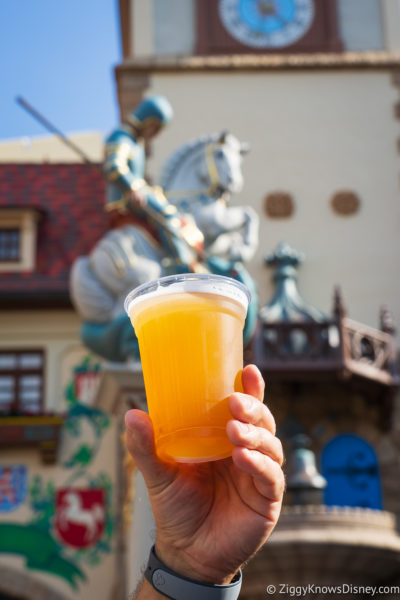 holding a beer in the air Germany pavilion EPCOT