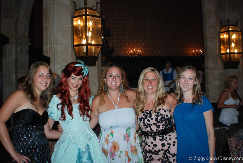 girls taking photo with Ariel at Cinderella's Royal Table character meal
