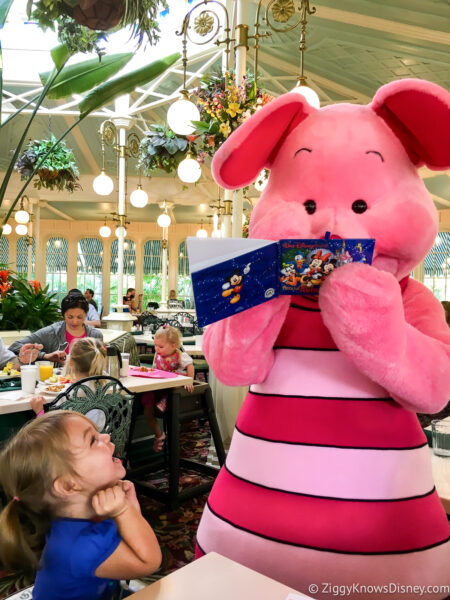 little girl getting autograph from Piglet at Crystal Palace