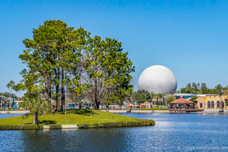 looking at Spaceship Earth across World Showcase Lagoon with trees in the middle