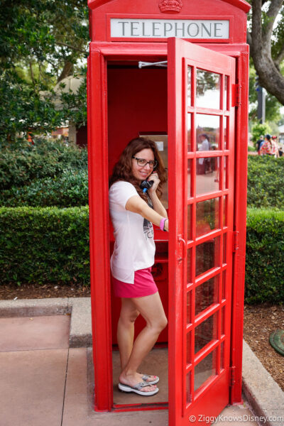 using the phone booth in UK Pavilion EPCOT