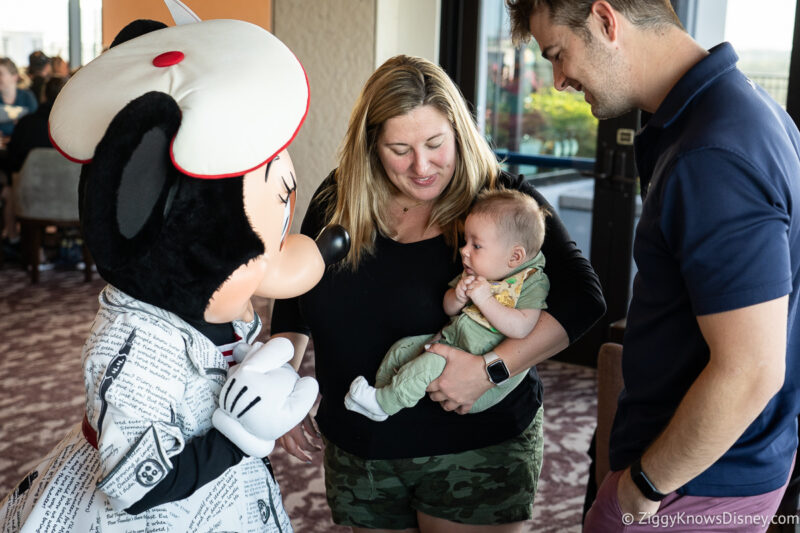 bringing baby to meet Minnie Mouse character Topolino's Terrace