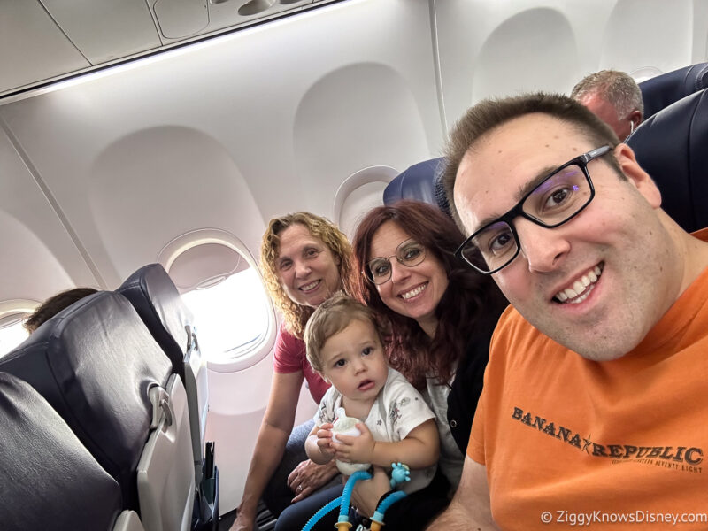 family on a plane heading to Walt Disney World