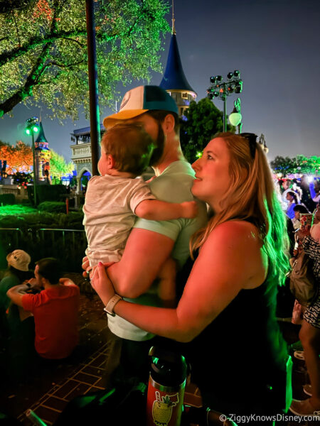 family watching the Magic Kingdom fireworks with baby